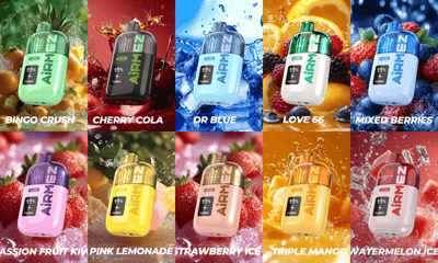 Twaalf kleurrijke AirMEN energiedrankflessen gerangschikt in een raster met fruit-splash-achtergronden.