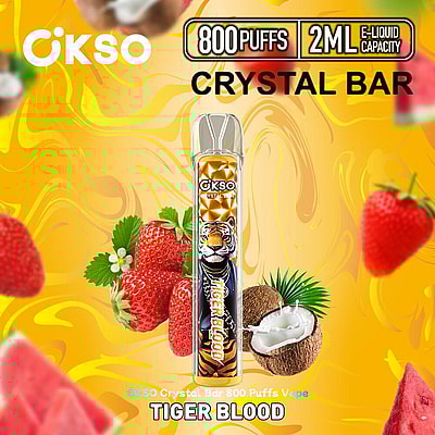 Imagem promocional do vaporizador OKSO Crystal Bar com sabor Tiger Blood, com morangos, cocos e melancias em um fundo amarelo vibrante. O dispositivo promete 800 tragadas e capacidade de 2 ml de e-líquido.