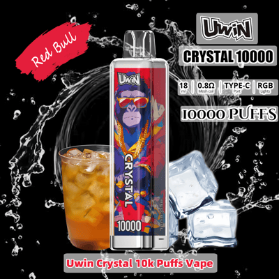 Promotional image featuring Uwin Crystal 10000 vape device with Red Bull flavor branding, displaying a colorful design with a gorilla illustration, surrounded by ice cubes and a glass of iced Red Bull beverage on a dynamic black background.