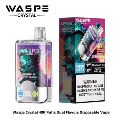 WASPE Crystal 40K Puffs Dual Flavors 使い捨て Vape デバイスとそのパッケージを特集した製品画像。鮮やかでカラフルなデザインとニコチン警告テキストでブルーベリーとチェリー コーラ アイスのフレーバーを強調しています。