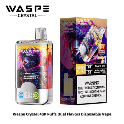 Waspe Crystal 40K Puffs デュアルフレーバー使い捨てベイプとそのパッケージ。ニコチン警告ラベルとともに「ピーチアイス」と「ウォーターメロンマンゴーピーチ」のフレーバーが表示されています。
