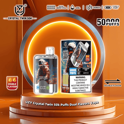 Promotional image of the UZY Crystal Twin 50k Puffs Dual Flavors Vape featuring a sleek device with astronaut-themed graphics, highlighting its features like dual mesh coil, 40ml capacity, Type-C port, and dual flavor functionality (Strawberry Kiwi and Grape Ice), set on an orange background with product details.