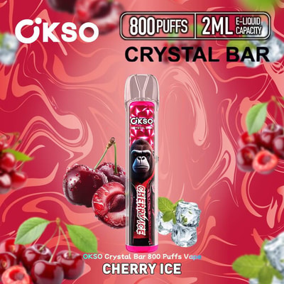 Image promotionnelle pour la vape OKSO Crystal Bar Cherry Ice, présentant le produit avec une illustration de gorille, entourée de cerises et de glaçons sur un fond rouge tourbillonnant.