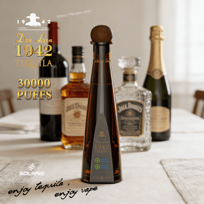 Tall dark tequila bottle with a round stopper labeled Don Leon 1942 Tequila on a table, with blurred bottles in the background.